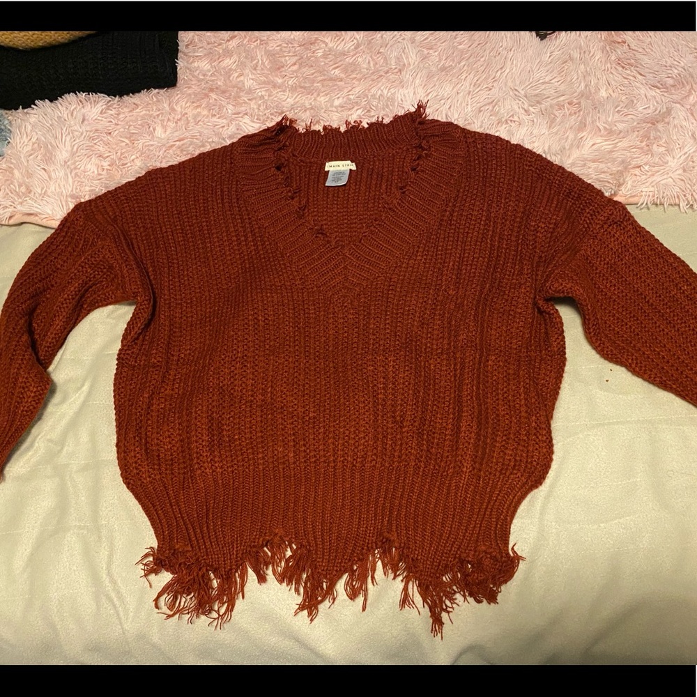 Dark red main strip medium sweater.